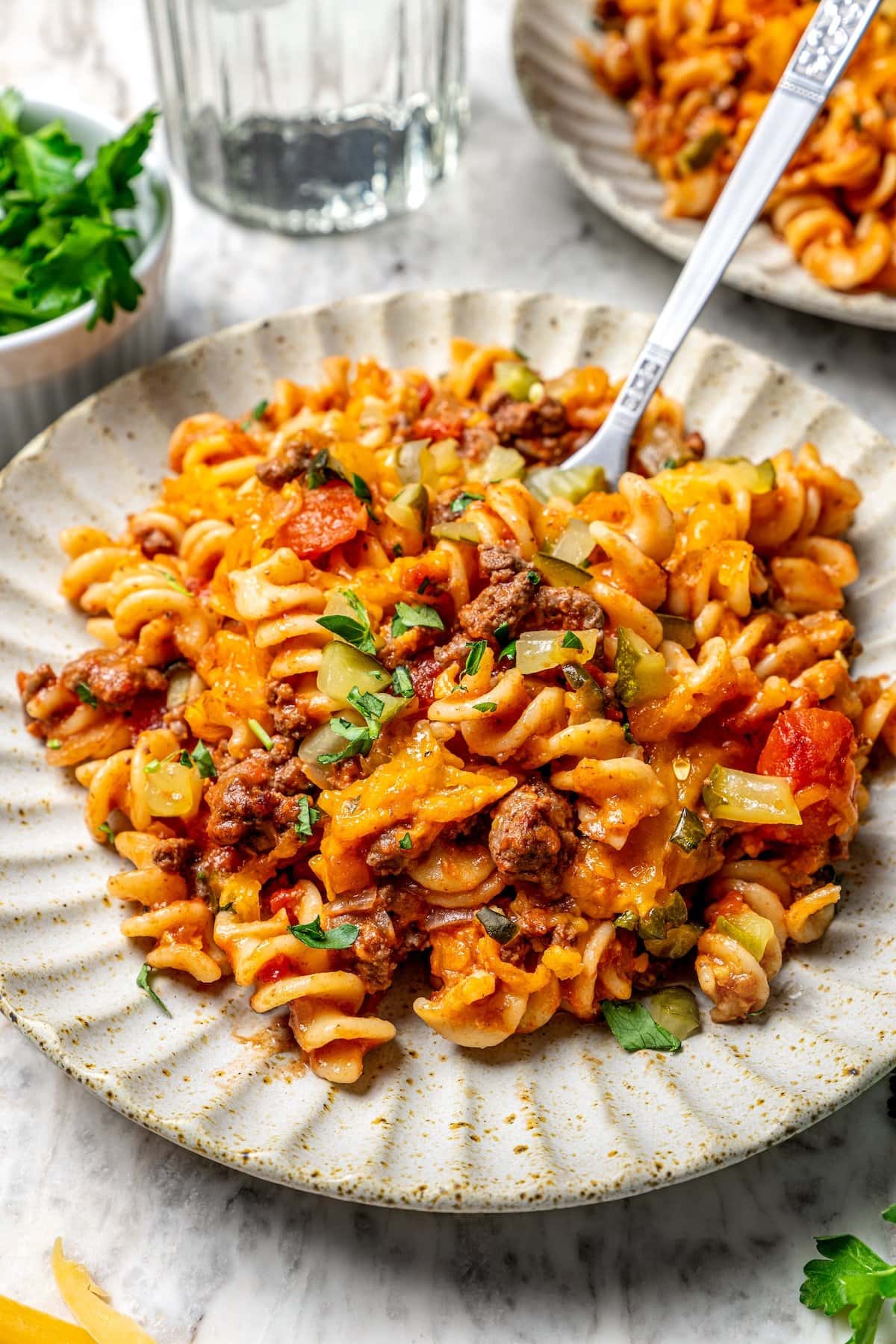 Cheeseburger casserole on plate with fork