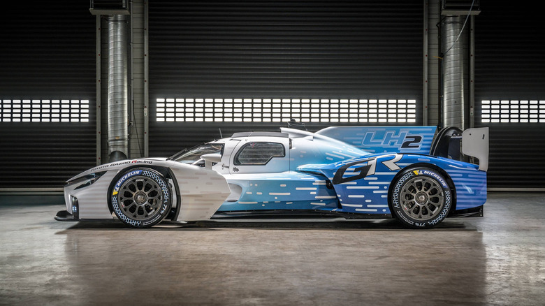A side view of the Toyota GR LH2 Racing Concept inside a garage